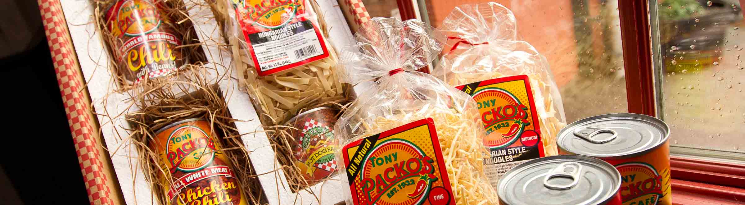 Tony Packo's Gift Pack open box with cans of hot dog chili sauce, chili, pickles & noodles