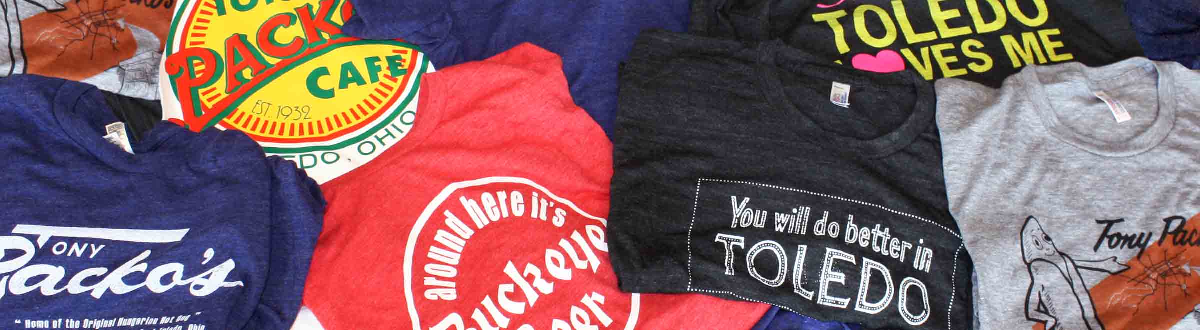 Black Somebody in Toledo Love Me, Dark Blue Tony Packos & Dark Blue TOLEDO t-shirt close-ups