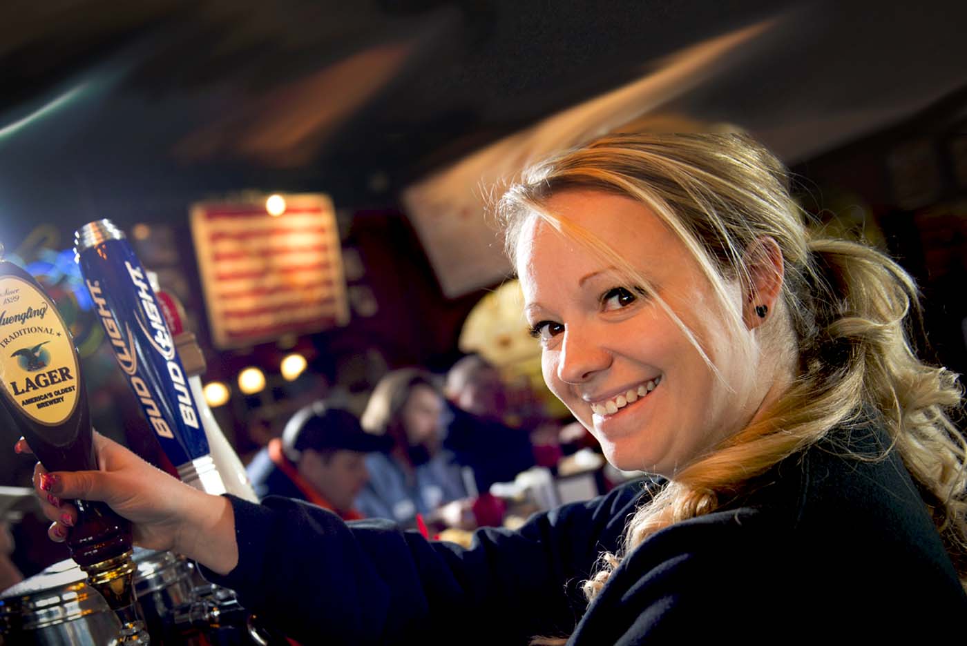 Waitress Serving Tony Packos to Hungry Customers enjoying themselves in the restaurant